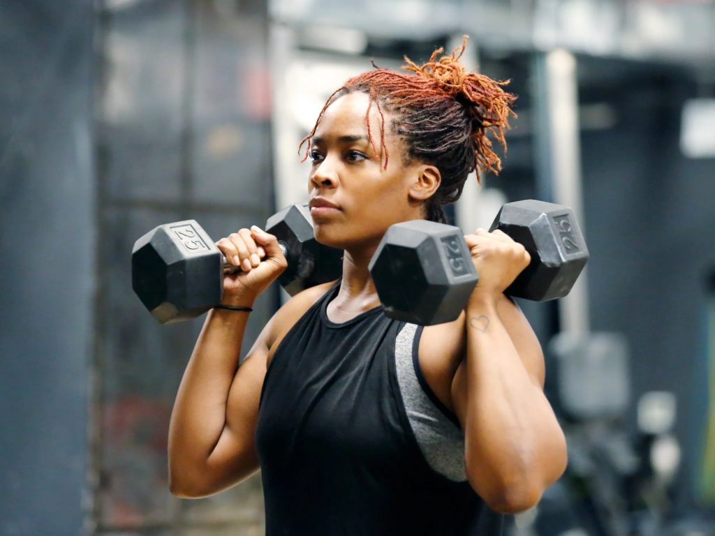 Woman lifting dumbbells