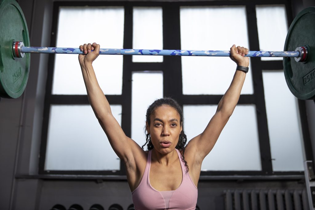 Woman training weightlifting gym (1)
