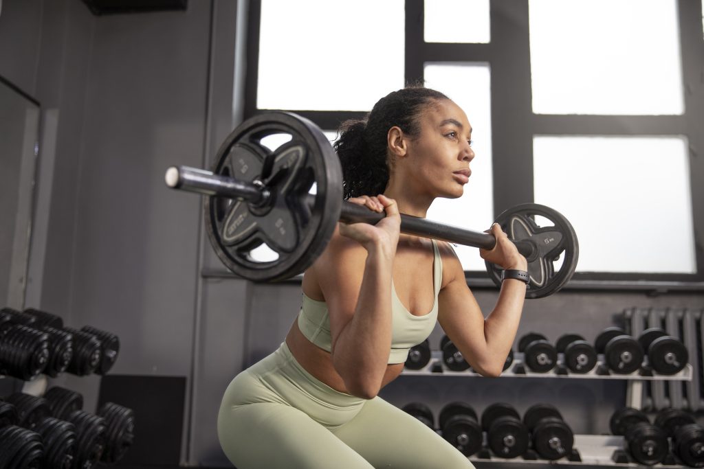 Woman training weightlifting gym